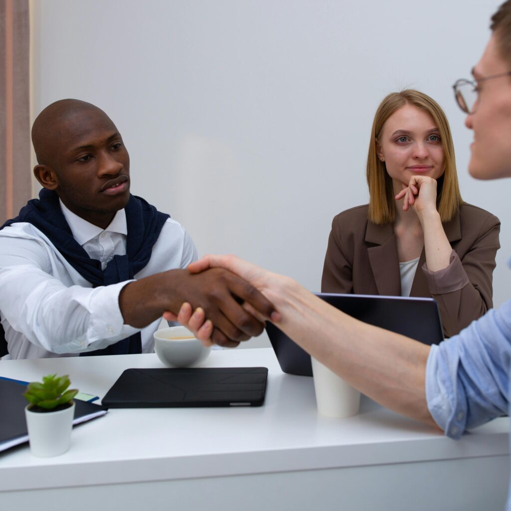 A diverse team in a professional meeting, symbolizing partnership and collaboration.